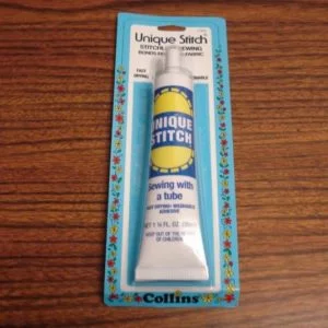 Tube of Unique Stitch Base Adhesive (used for adhering cloth and velour)