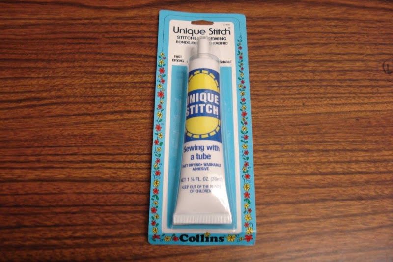 Tube of Unique Stitch Base Adhesive (used for adhering cloth and velour)