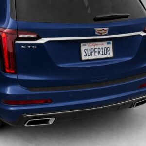 Black vinyl rear sill plate installed on the rear bumper loading edge of a 2023 Cadillac XT6.