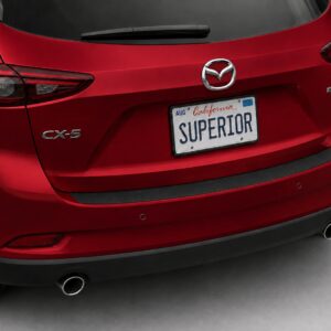 Black vinyl rear sill plate installed on the rear bumper loading edge of a 2020 Mazda CX-5.