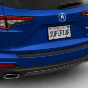 Black vinyl rear sill plate installed on the rear bumper loading edge of a 2023 Acura RDX.