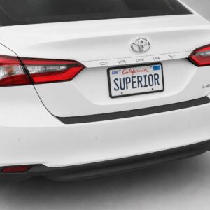 Black vinyl rear sill plate installed on the rear bumper loading edge of a 2023 Toyota Camry.