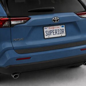Black vinyl rear sill plate installed on the rear bumper loading edge of a 2023 Toyota RAV4.