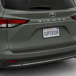 Black vinyl rear sill plate installed on the rear bumper loading edge of a 2023 Toyota Sienna.